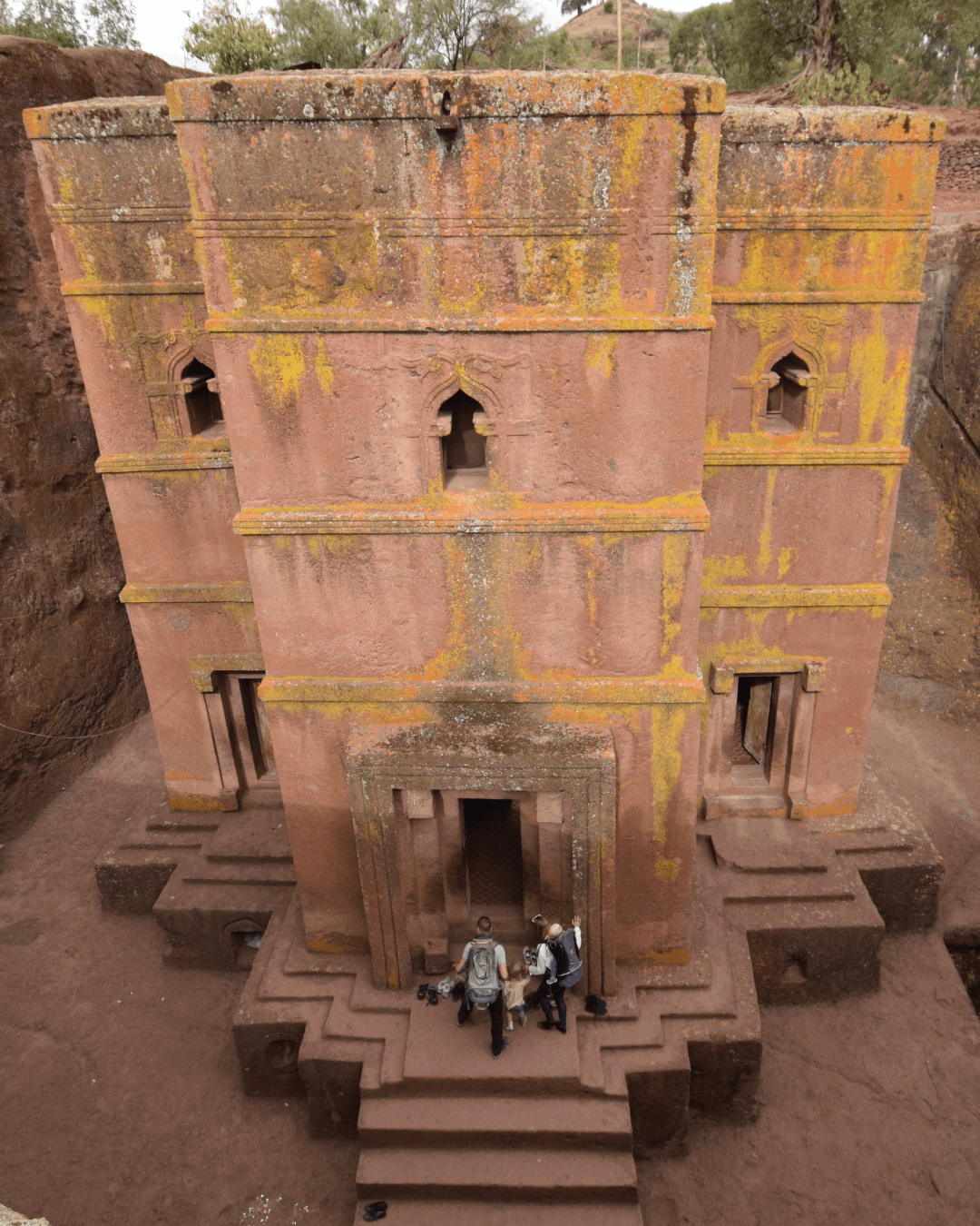 Interior of a building with columns and flags
