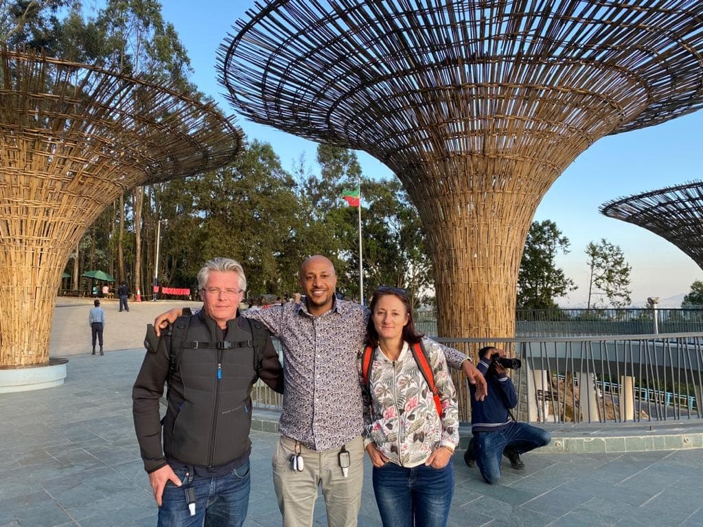Interior of a building with columns and flags