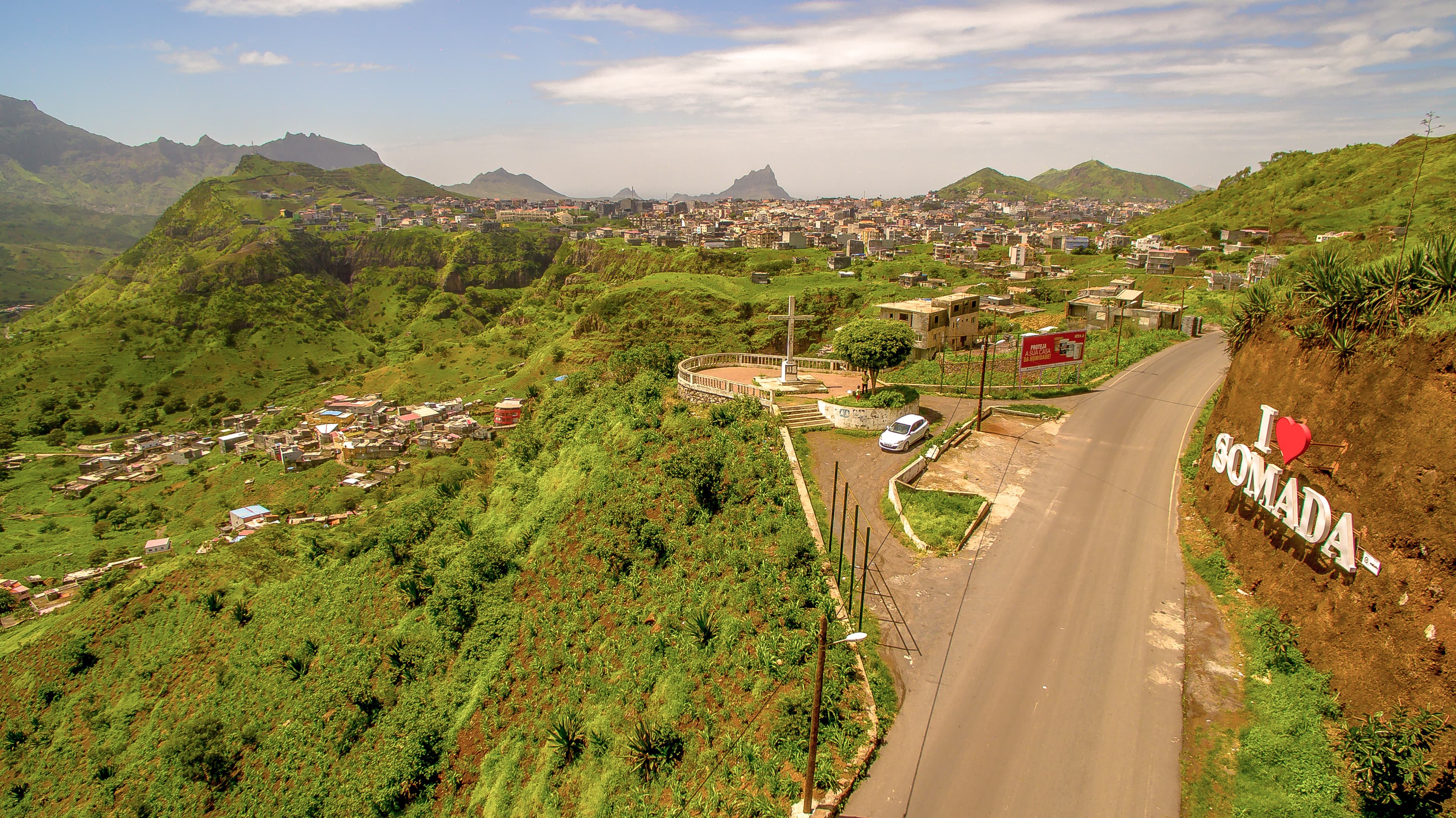 Interior of a building with columns and flags