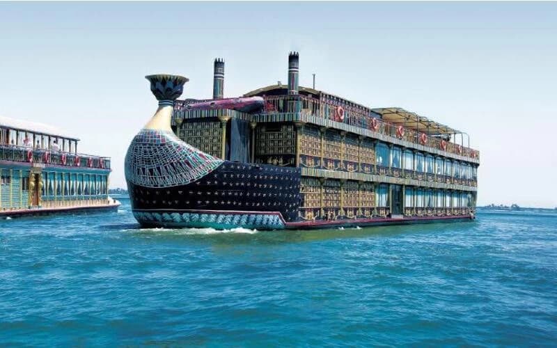 Interior of a building with columns and flags