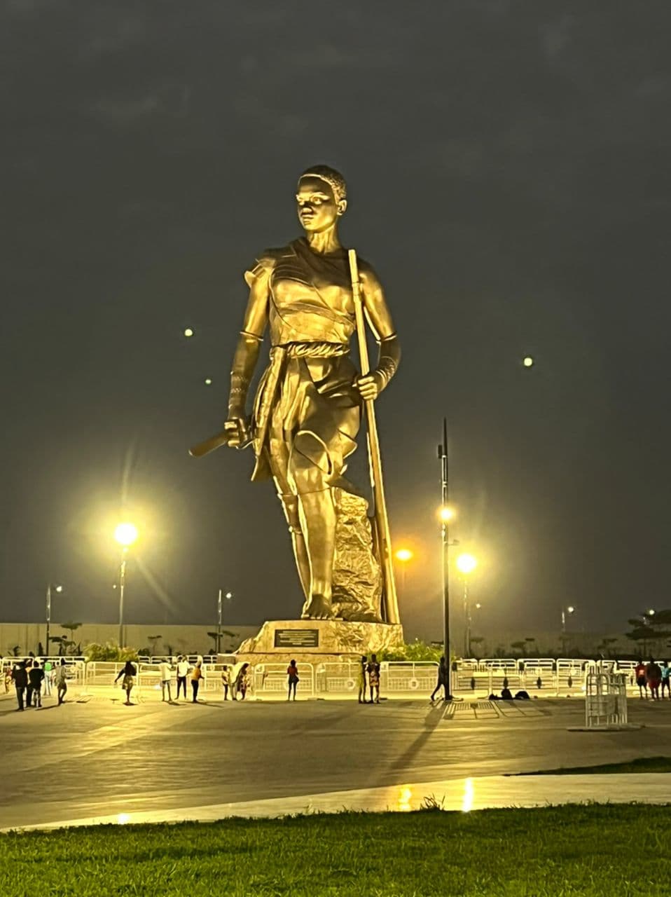 Interior of a building with columns and flags