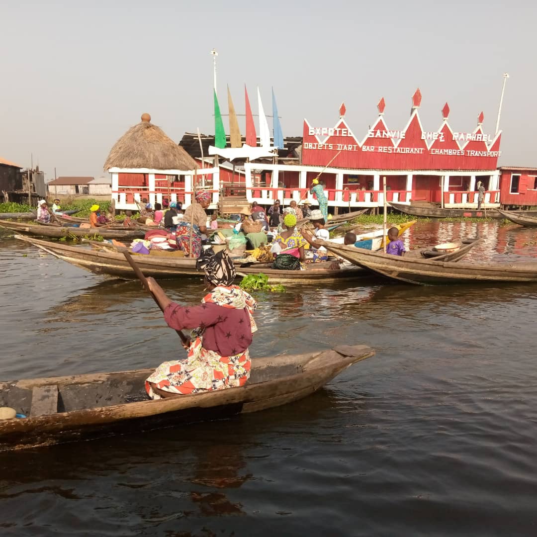 Interior of a building with columns and flags