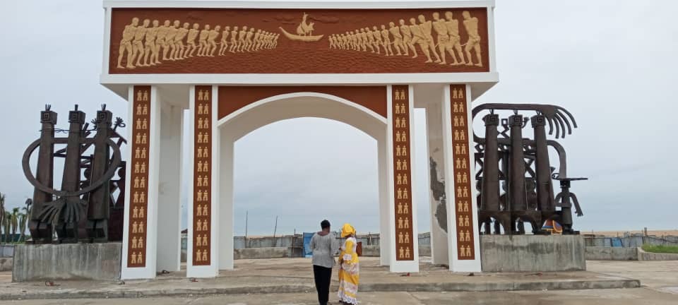 Interior of a building with columns and flags