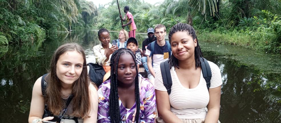 Interior of a building with columns and flags