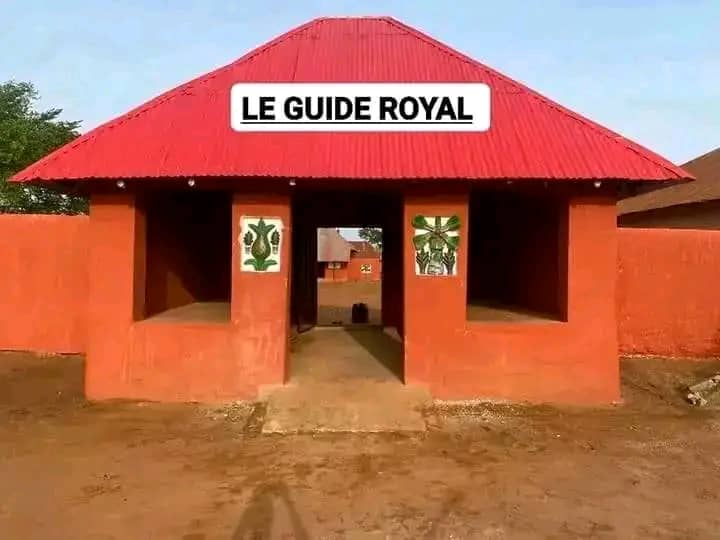 Interior of a building with columns and flags