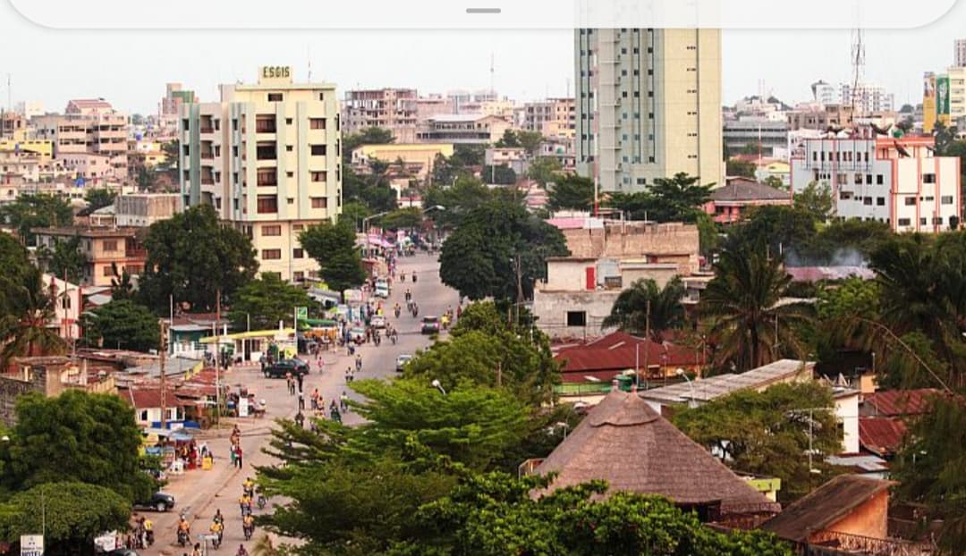 Interior of a building with columns and flags