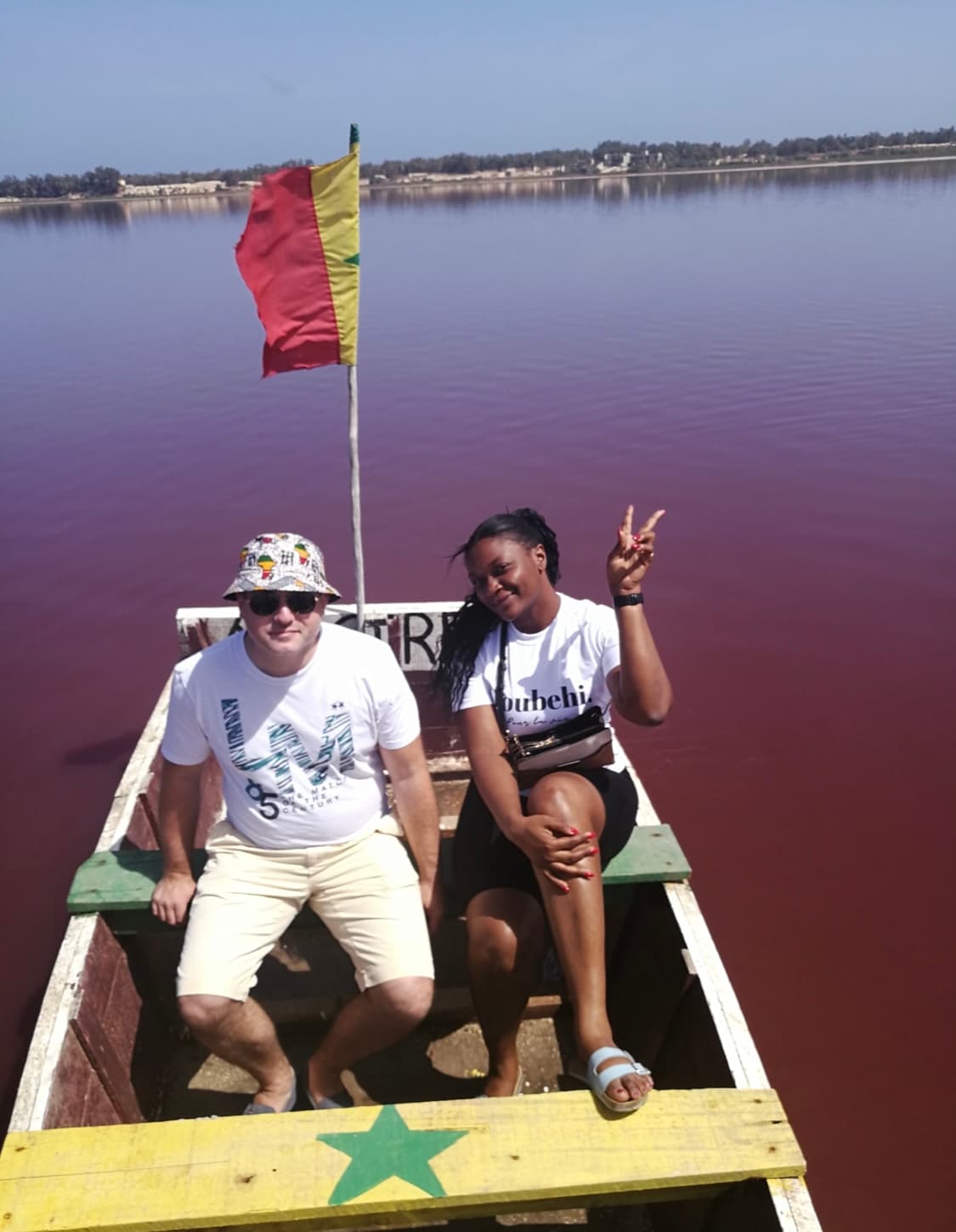 Interior of a building with columns and flags