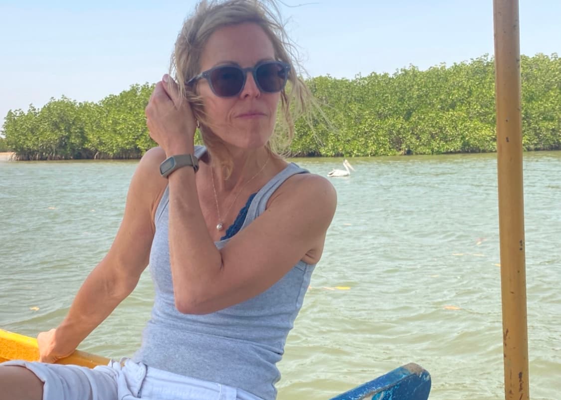 Interior of a building with columns and flags