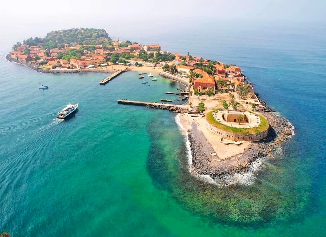 Interior of a building with columns and flags