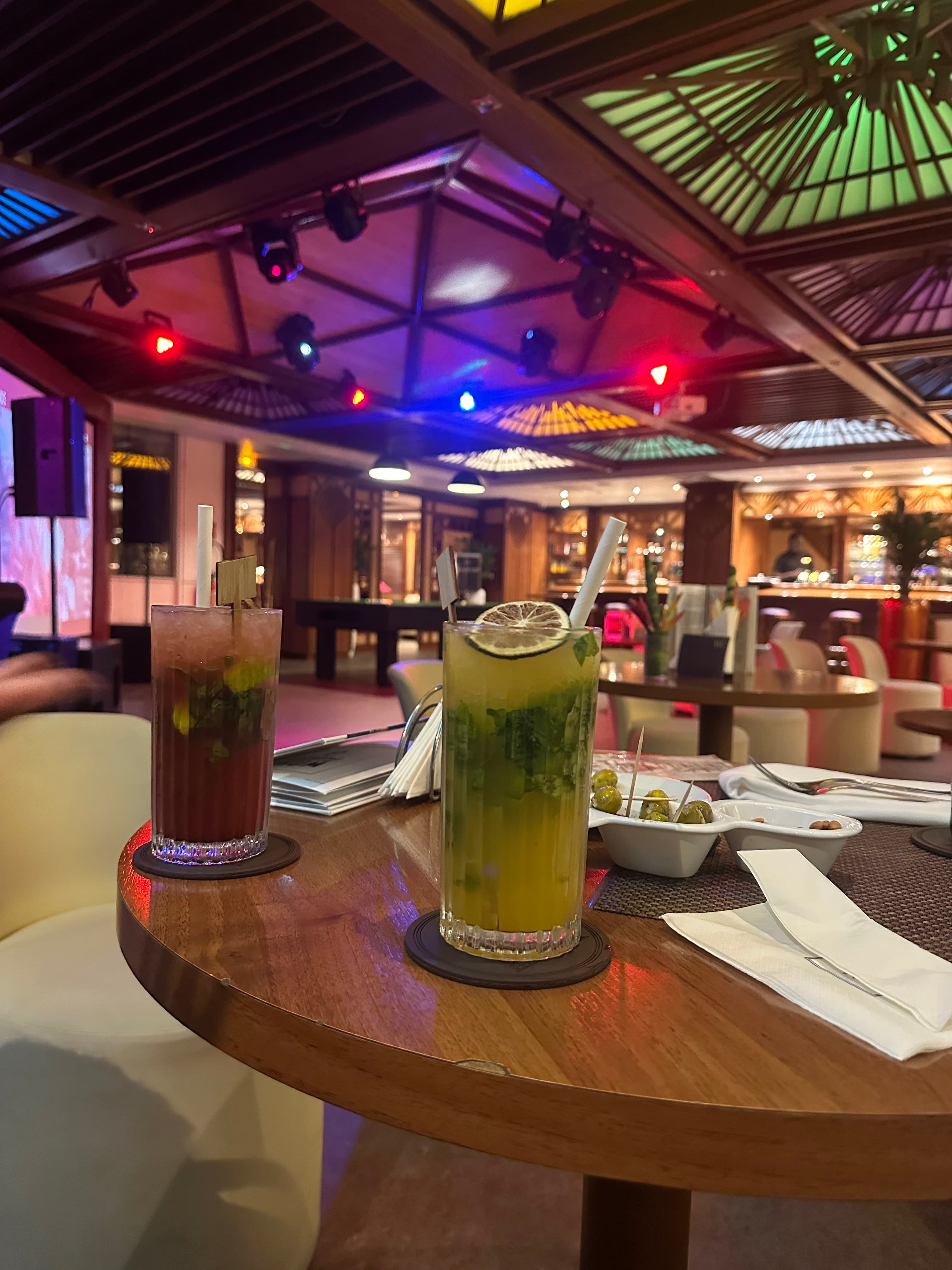 Interior of a building with columns and flags